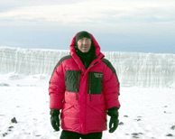 Al on summit with glacier in rear