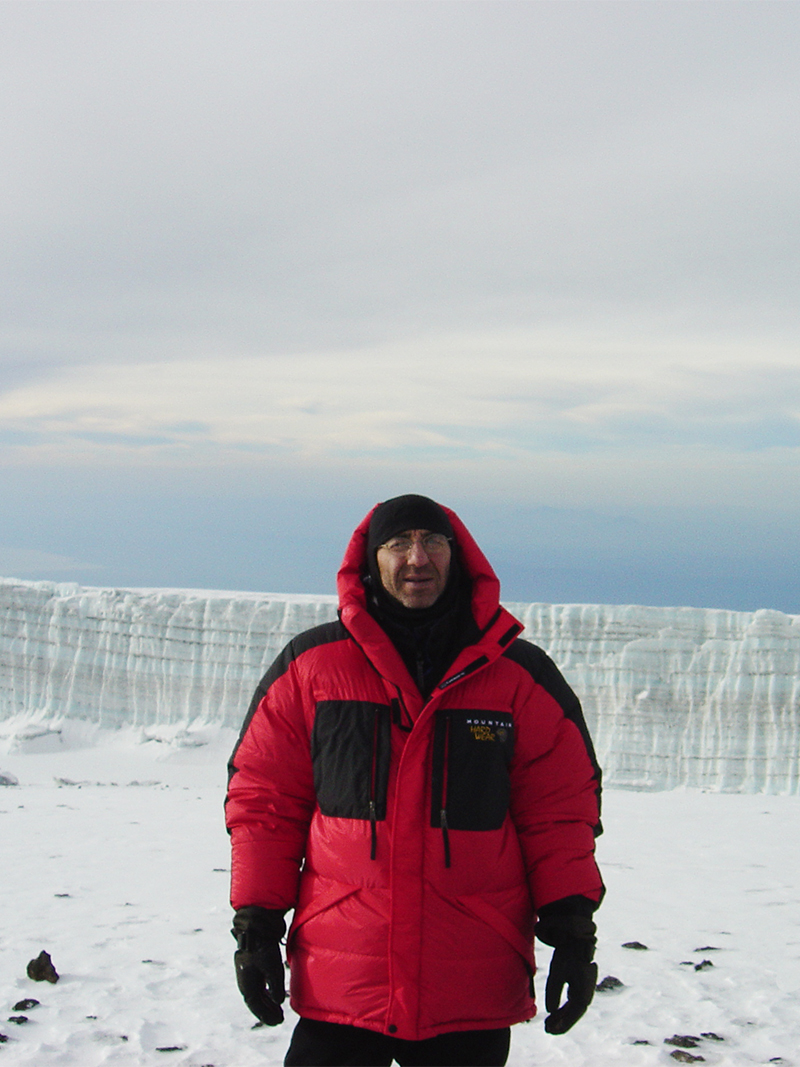 Al on summit with glacier in rear